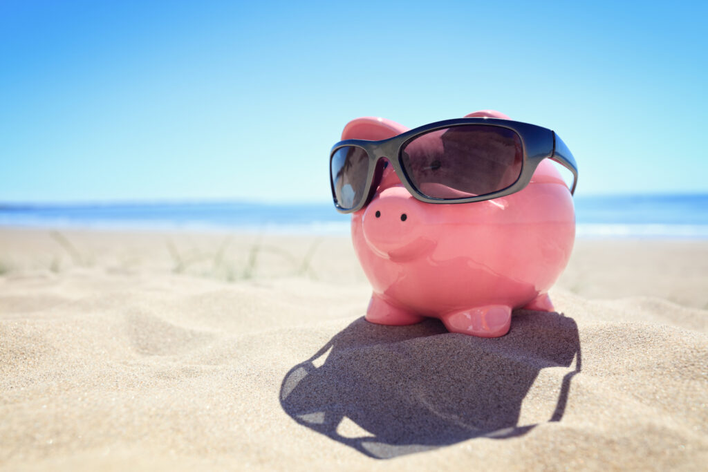 Piggybank on beach conveying a relaxed feeling towards the complex topic of taxes and mortgage insurance